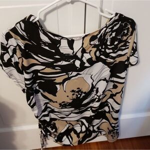 Flowers silky short sleeve blouse with side‎ tie accent. Size Large